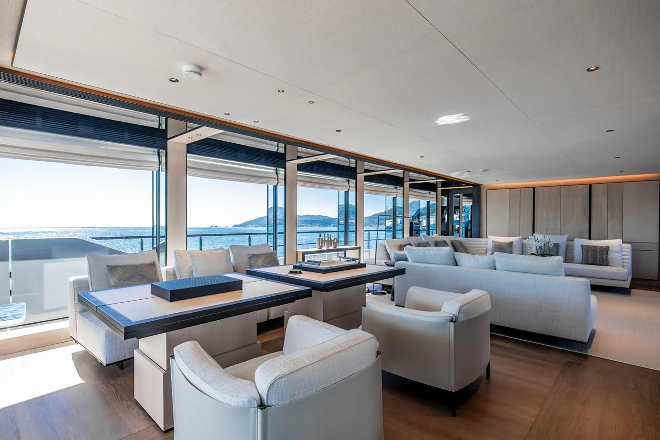 The spacious salon offers panoramic views and luxurious seating arrangements. aboard ANDALA Yacht for Sale