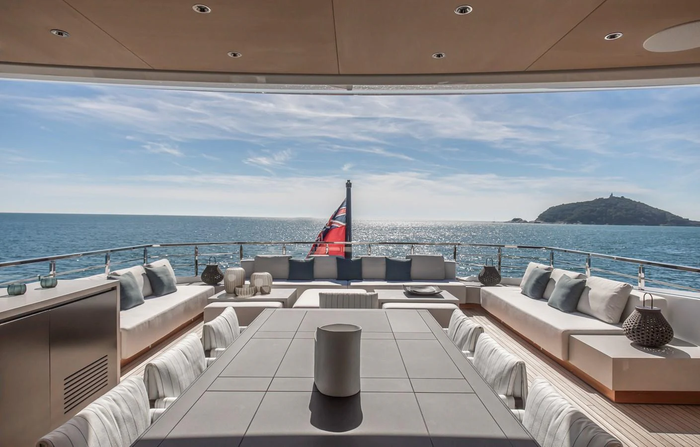 The aft deck offers a luxurious outdoor seating area with stunning ocean views. aboard ANDALA Yacht for Sale