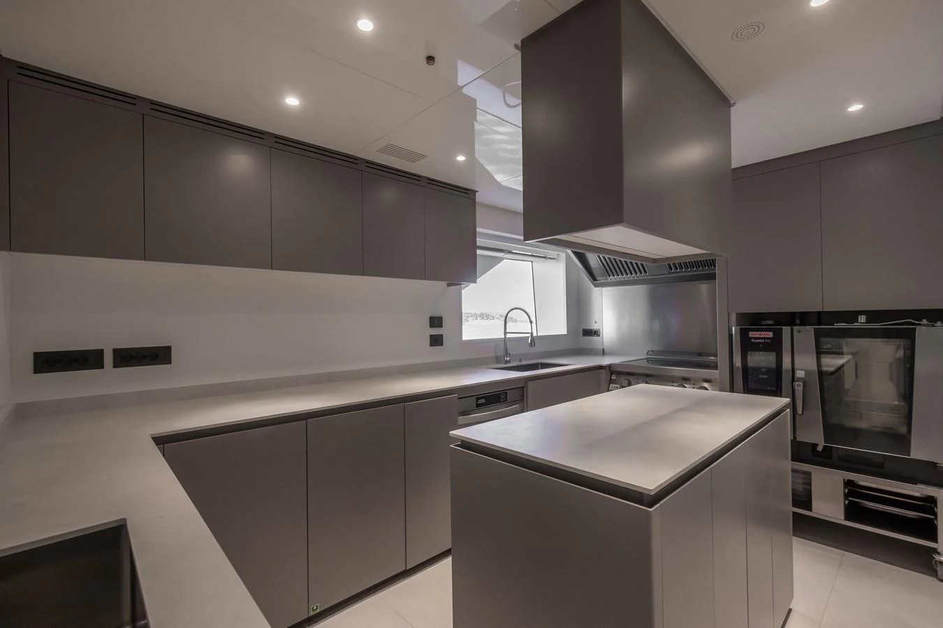 The modern galley features sleek cabinetry and state-of-the-art appliances. aboard ANDALA Yacht for Sale