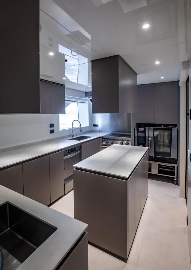 A sleek and modern galley with high-end appliances and ample counter space. aboard ANDALA Yacht for Sale