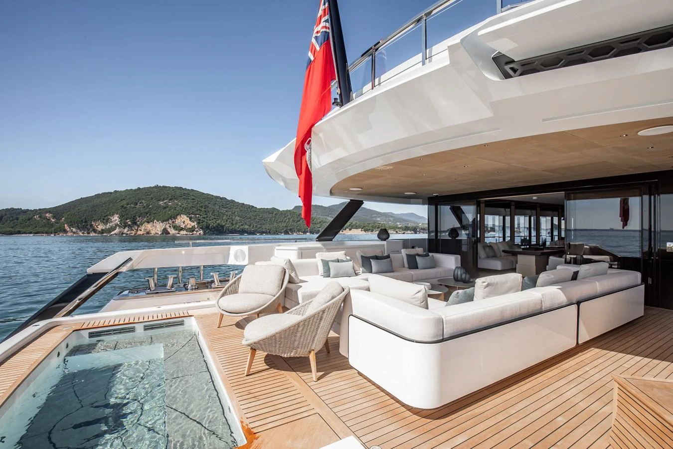 The aft deck features luxurious seating and a pool, perfect for relaxation and entertainment. aboard ANDALA Yacht for Sale