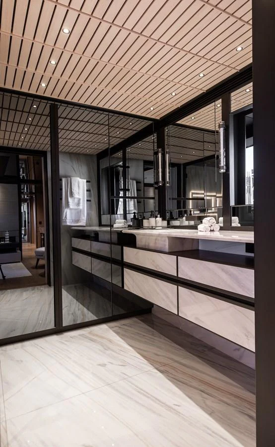 The yacht's bathroom features a sleek, modern design with luxurious finishes and ample lighting. aboard ANDALA Yacht for Sale