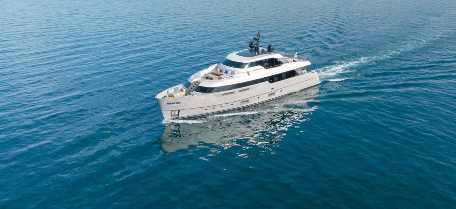 A sleek yacht cruises smoothly on tranquil waters, showcasing its modern design. aboard FATSA Yacht for Sale