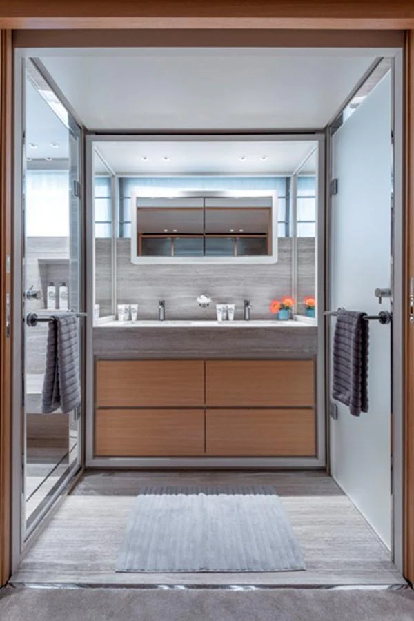 A modern and elegant yacht bathroom with sleek fixtures and ample storage. aboard FATSA Yacht for Sale