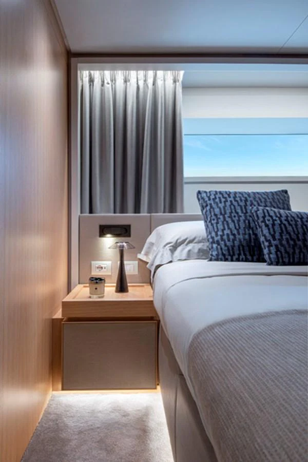 A cozy stateroom with a modern design, featuring a comfortable bed and stylish decor. aboard FATSA Yacht for Sale