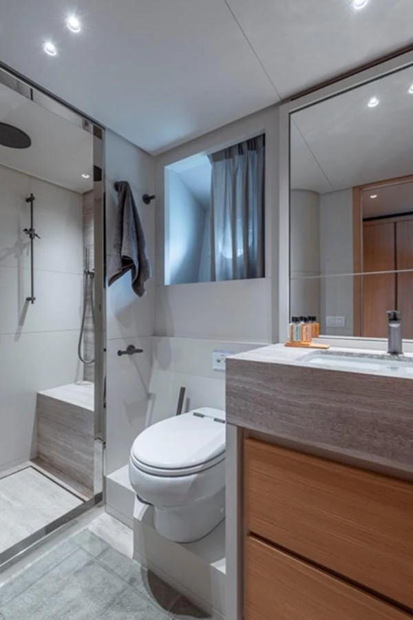 A modern yacht bathroom featuring a sleek shower and contemporary fixtures. aboard FATSA Yacht for Sale
