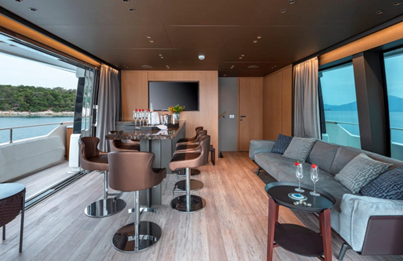 The yacht's salon features a modern and spacious design with ample seating and large windows offering stunning views. aboard FATSA Yacht for Sale