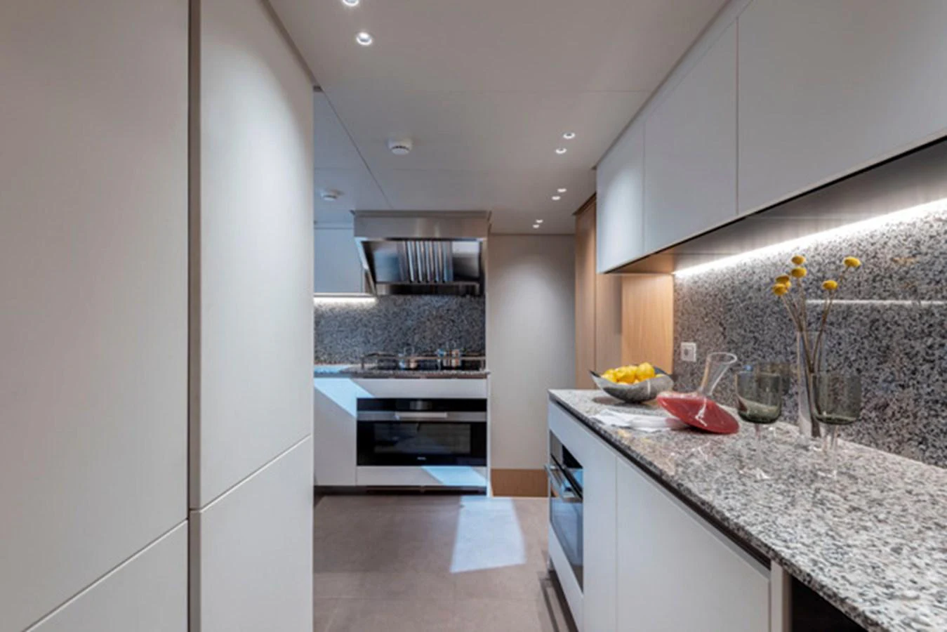 The yacht's galley features modern appliances and a sleek design with ample counter space. aboard FATSA Yacht for Sale