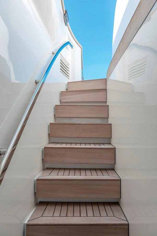 Elegant wooden steps lead up to the upper deck of the yacht. aboard FATSA Yacht for Sale