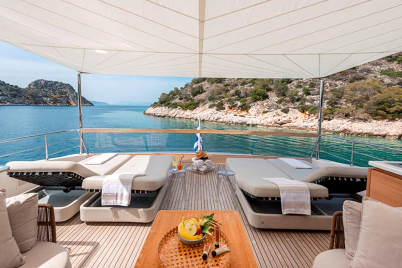 The sundeck offers a serene setting with comfortable loungers and a stunning view of the surrounding waters. aboard FATSA Yacht for Sale