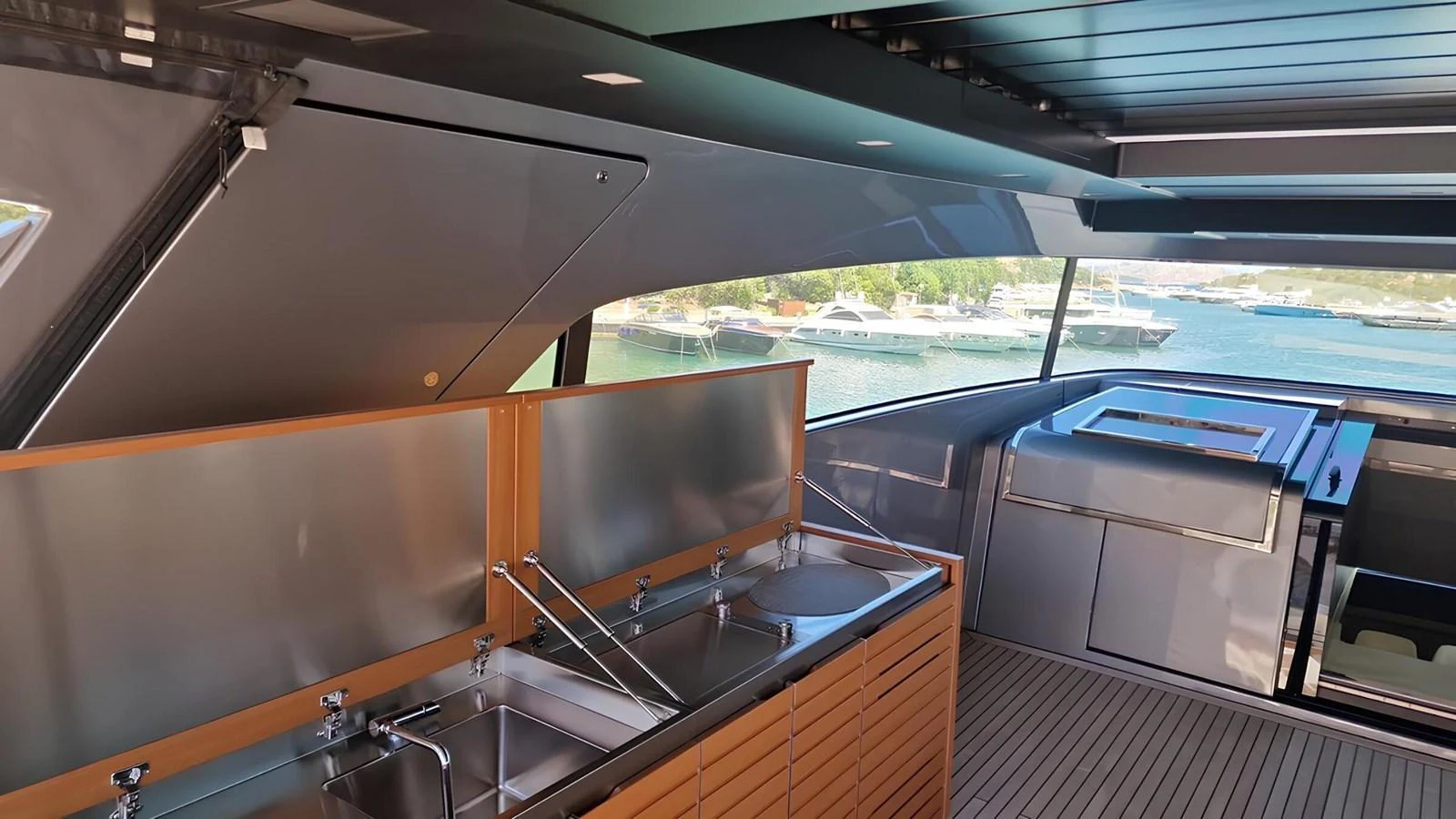 The yacht's galley features modern appliances and ample counter space with a view of the surrounding waters. aboard LYDIA Yacht for Sale