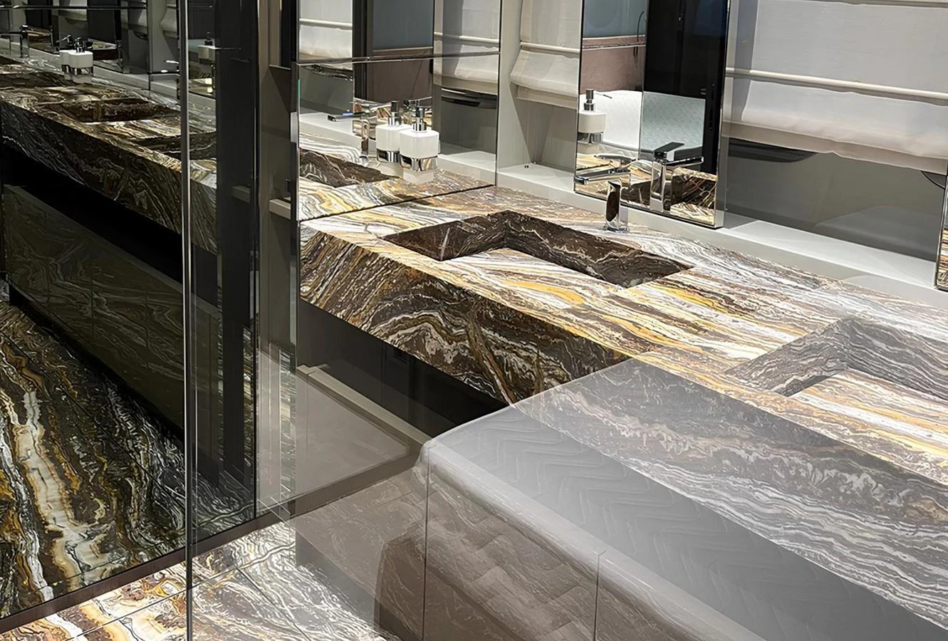 The yacht's bathroom features luxurious marble countertops and modern fixtures. aboard LYDIA Yacht for Sale
