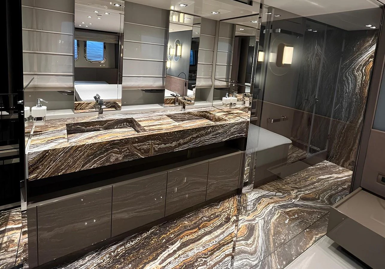The yacht's bathroom features luxurious marble countertops and modern fixtures. aboard LYDIA Yacht for Sale