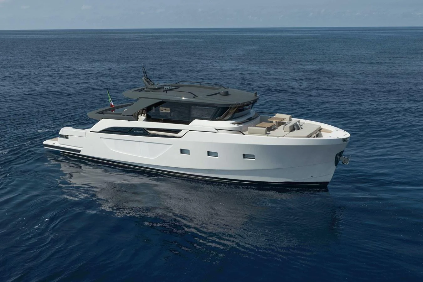 A sleek and modern yacht cruising on calm blue waters. aboard BLUEGAME BGX63 #49 Yacht for Sale