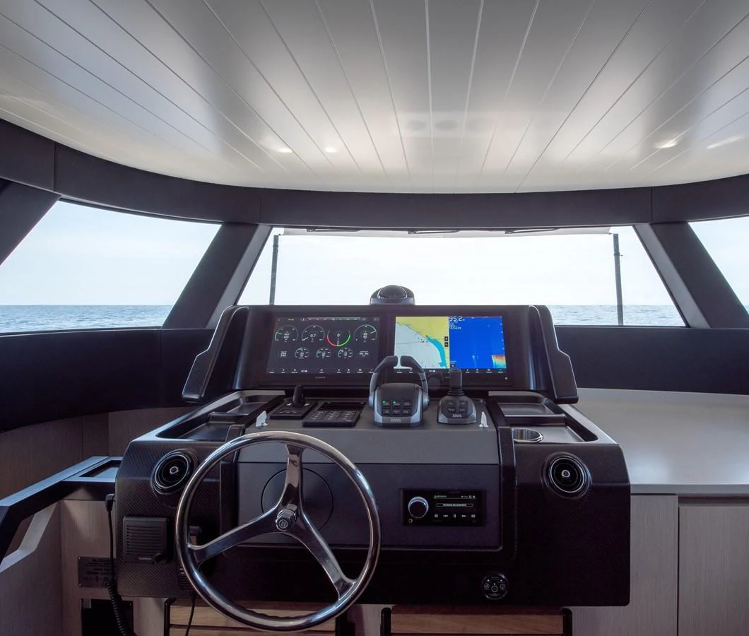 The helm station offers a modern and sophisticated control area with advanced navigation equipment. aboard BLUEGAME BGX63 #49 Yacht for Sale