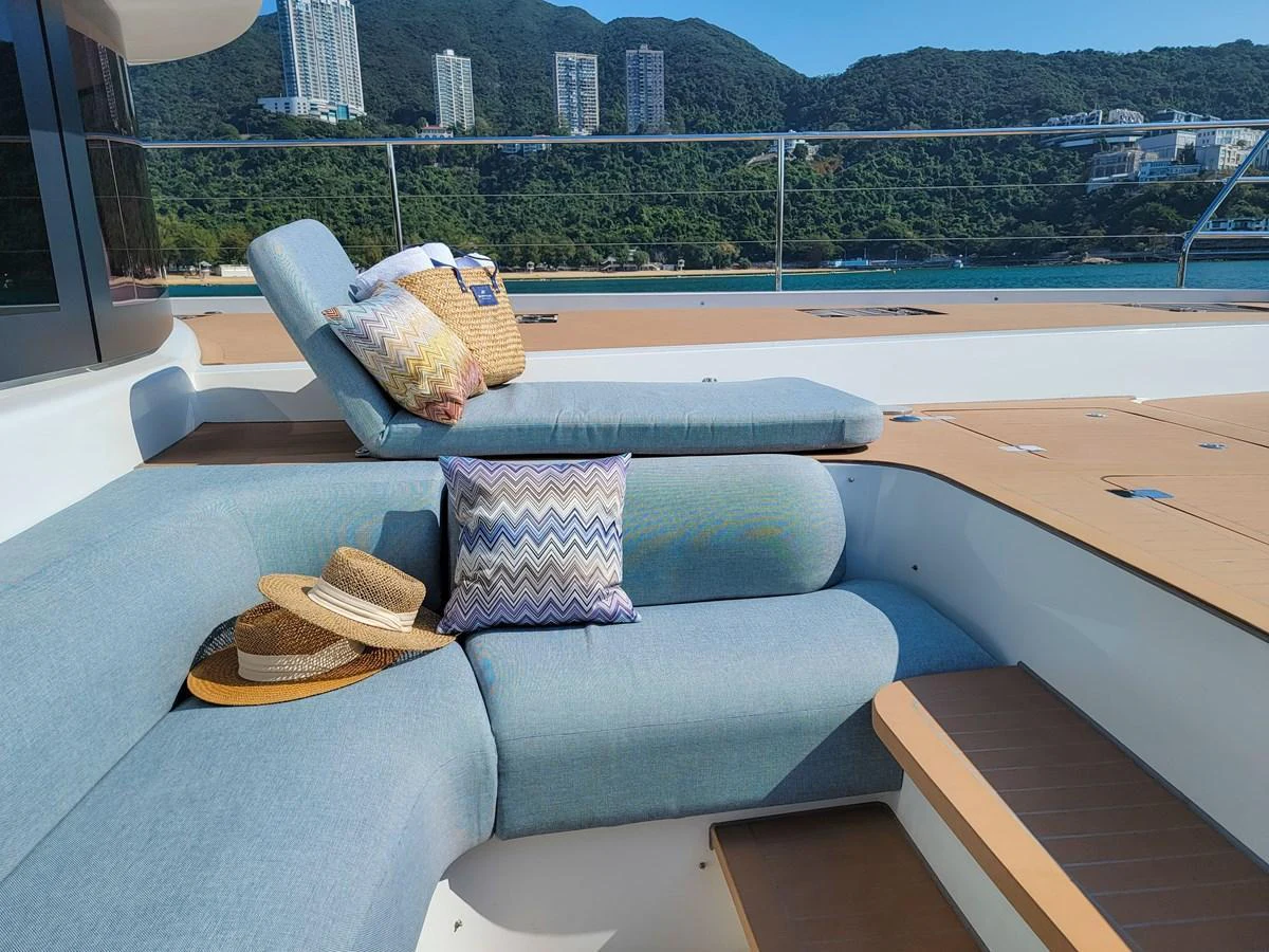 The sundeck features comfortable seating and sun loungers with scenic views. aboard LAGOON SIXTY 7 Yacht for Sale