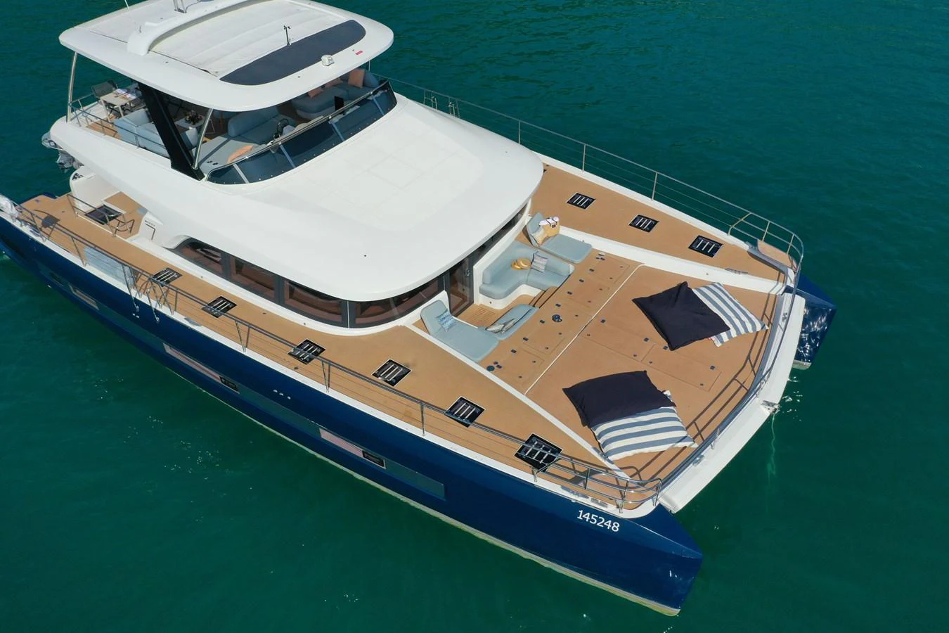 This yacht features a spacious flybridge and ample deck space, perfect for relaxation and entertainment on the water. aboard LAGOON SIXTY 7 Yacht for Sale