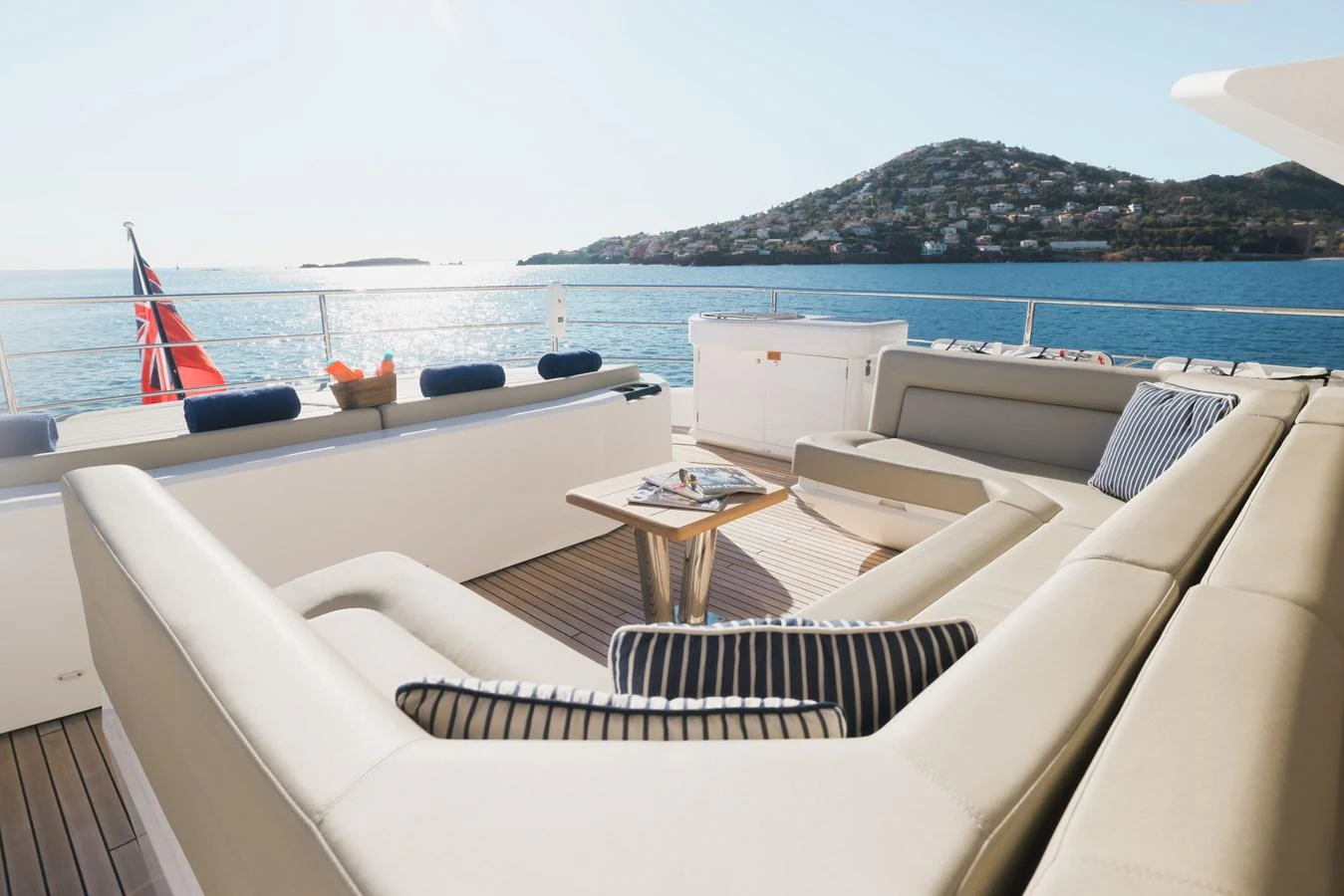 The aft deck offers a luxurious seating area with stunning views of the sea and nearby islands. aboard KING POWER Yacht for Sale