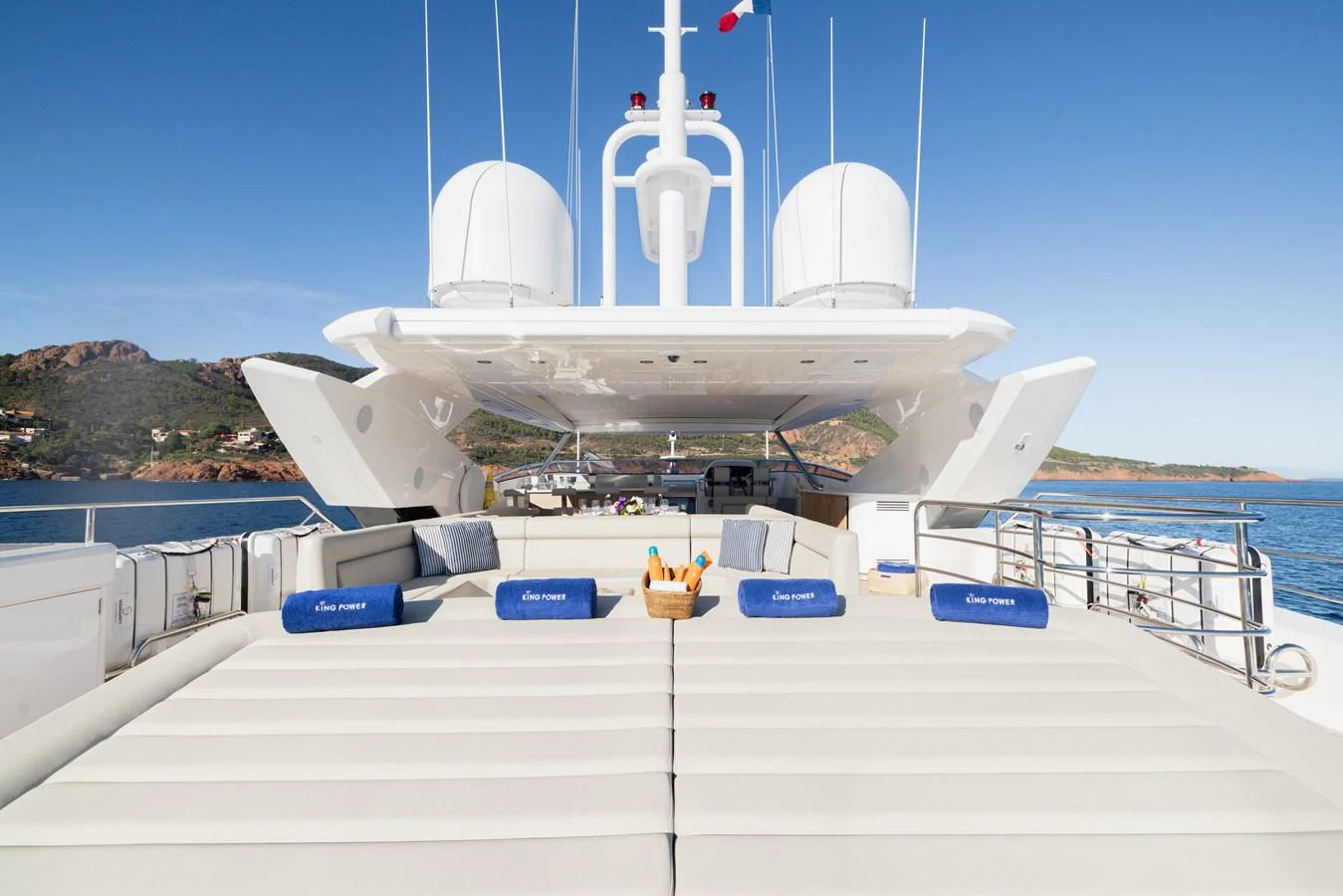 The sundeck offers a spacious lounging area with plush seating and stunning views. aboard KING POWER Yacht for Sale