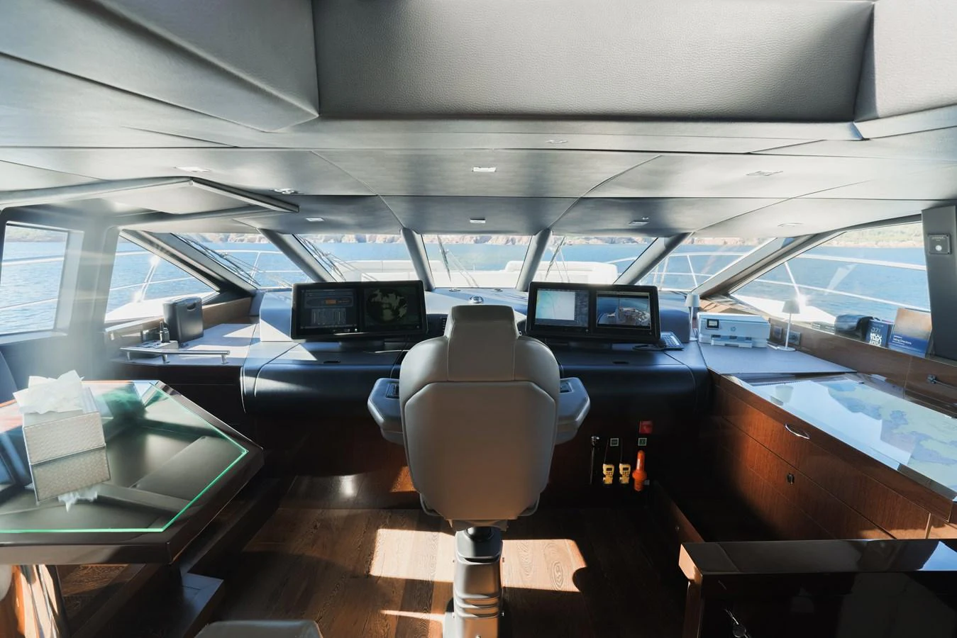 The helm station offers a panoramic view with state-of-the-art navigation equipment. aboard KING POWER Yacht for Sale