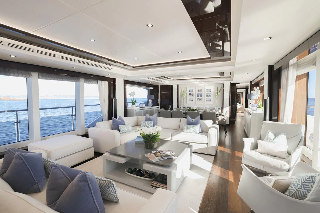 The spacious salon offers luxurious seating with panoramic ocean views. aboard KING POWER Yacht for Sale