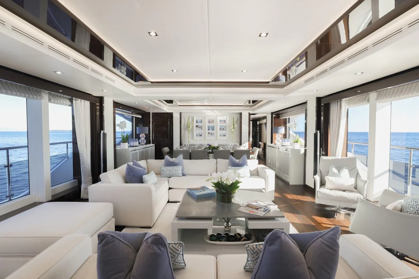 The salon offers a spacious and luxurious seating area with panoramic ocean views. aboard KING POWER Yacht for Sale