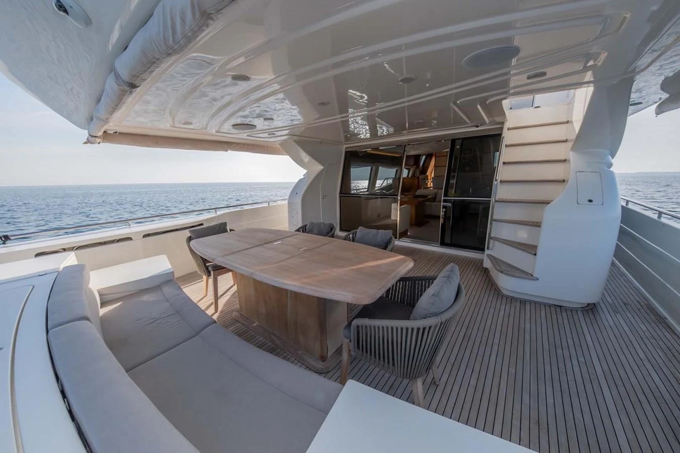 a room with a table and chairs aboard STELLINA Yacht for Sale