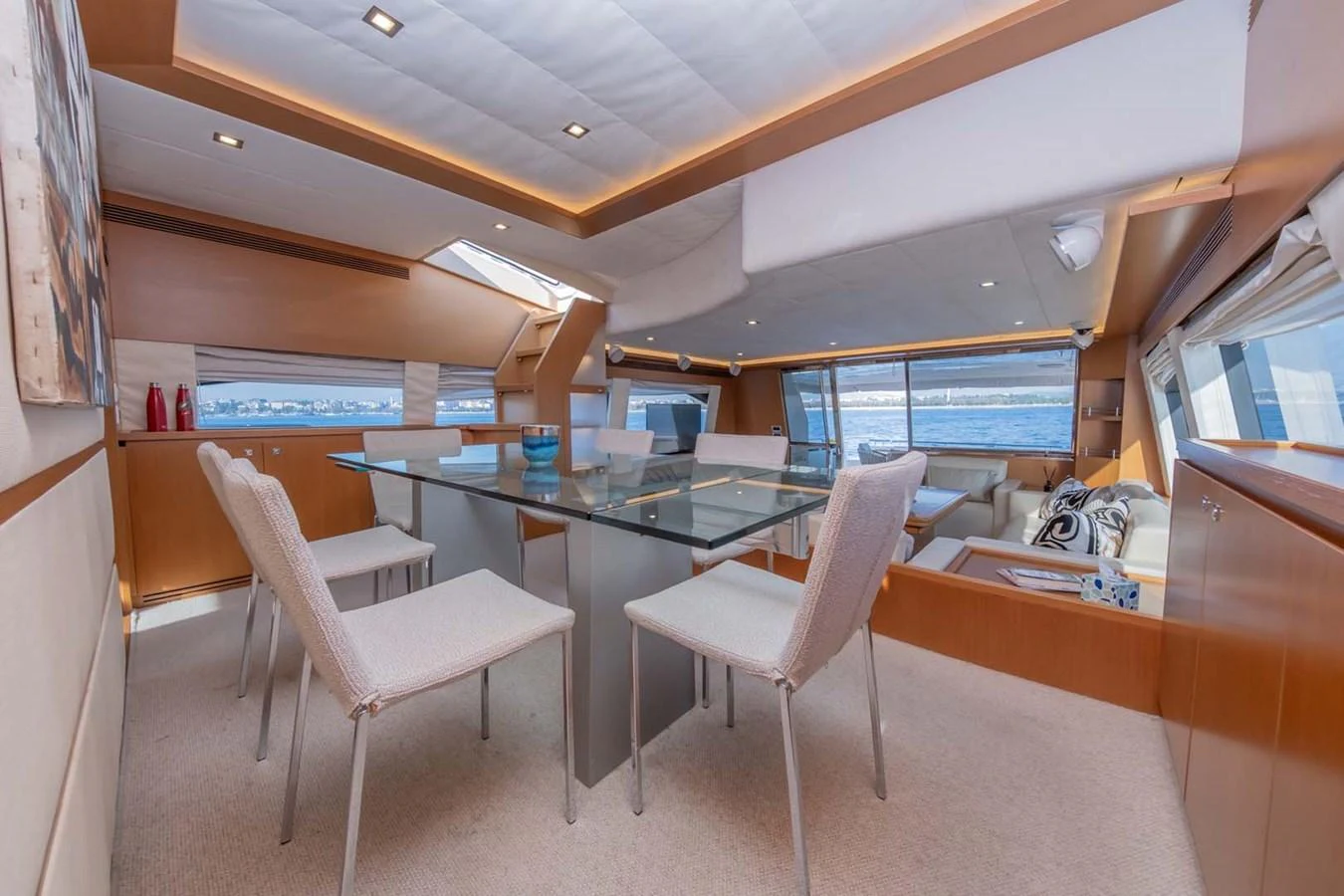 a room with a table and chairs aboard STELLINA Yacht for Sale