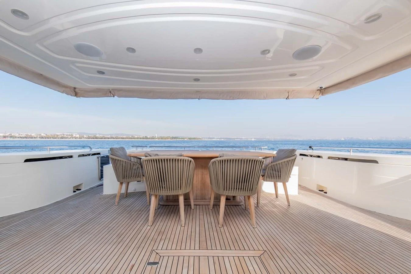 a table and chairs on a deck aboard STELLINA Yacht for Sale