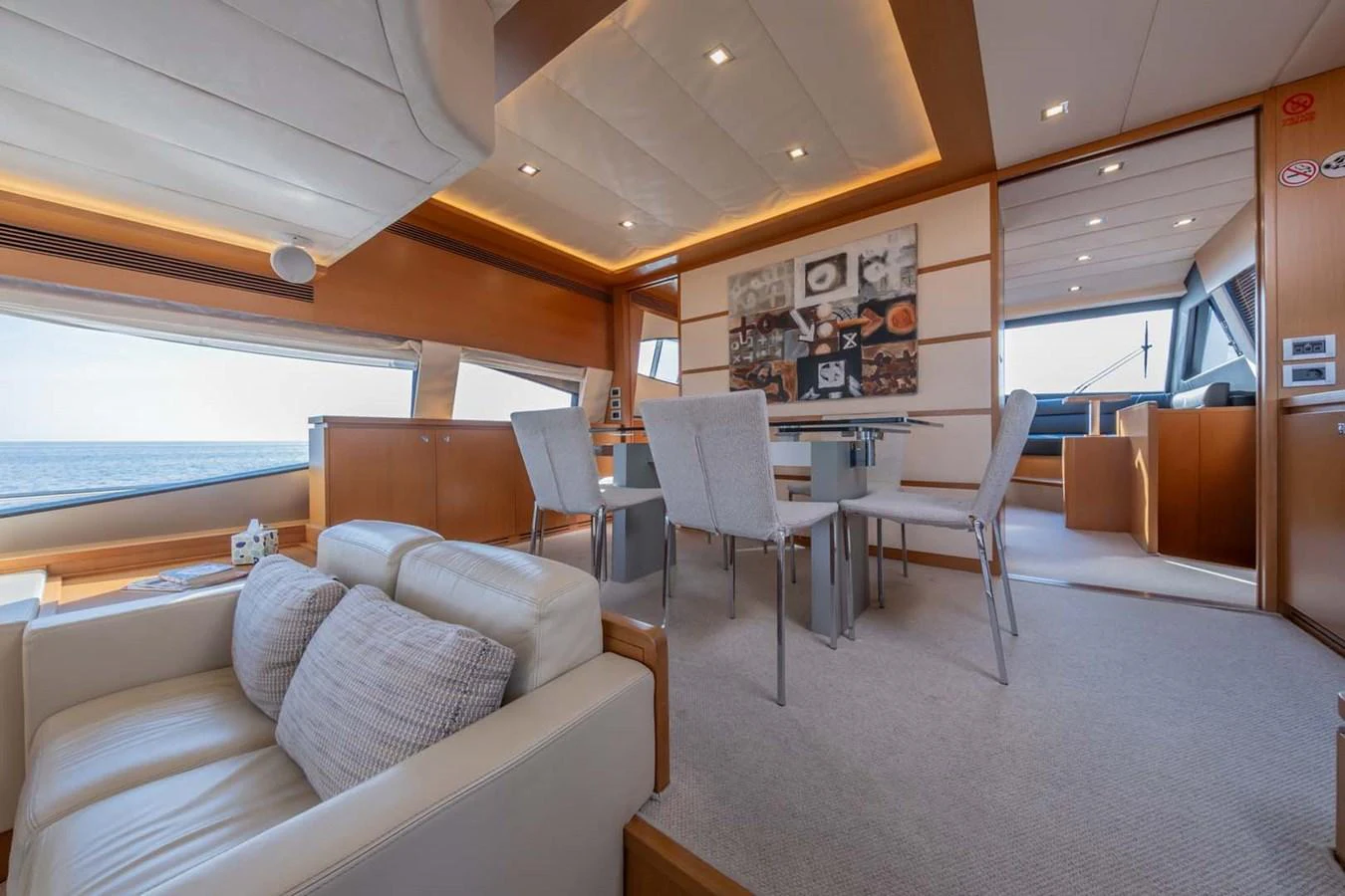 a living room with a couch and chairs aboard STELLINA Yacht for Sale