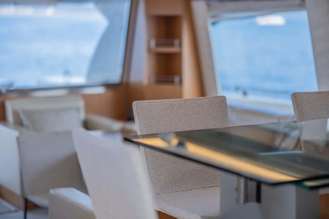 a table with chairs and a computer aboard STELLINA Yacht for Sale