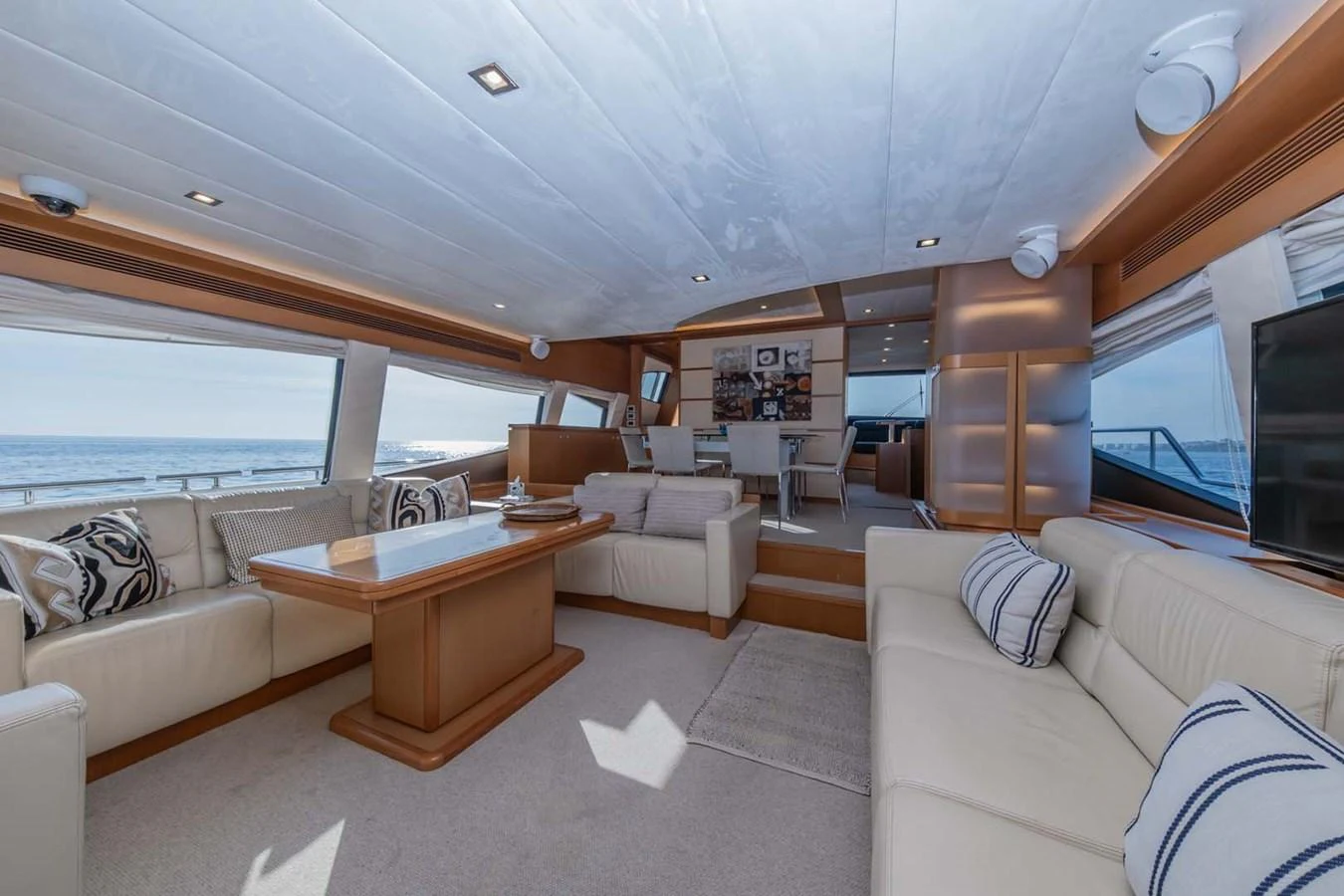 a living room with a large window aboard STELLINA Yacht for Sale