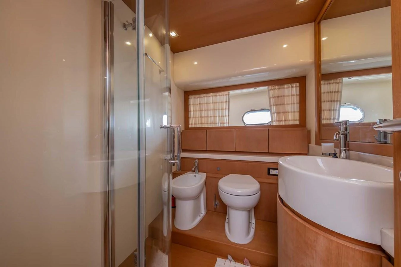 a bathroom with a glass shower aboard STELLINA Yacht for Sale