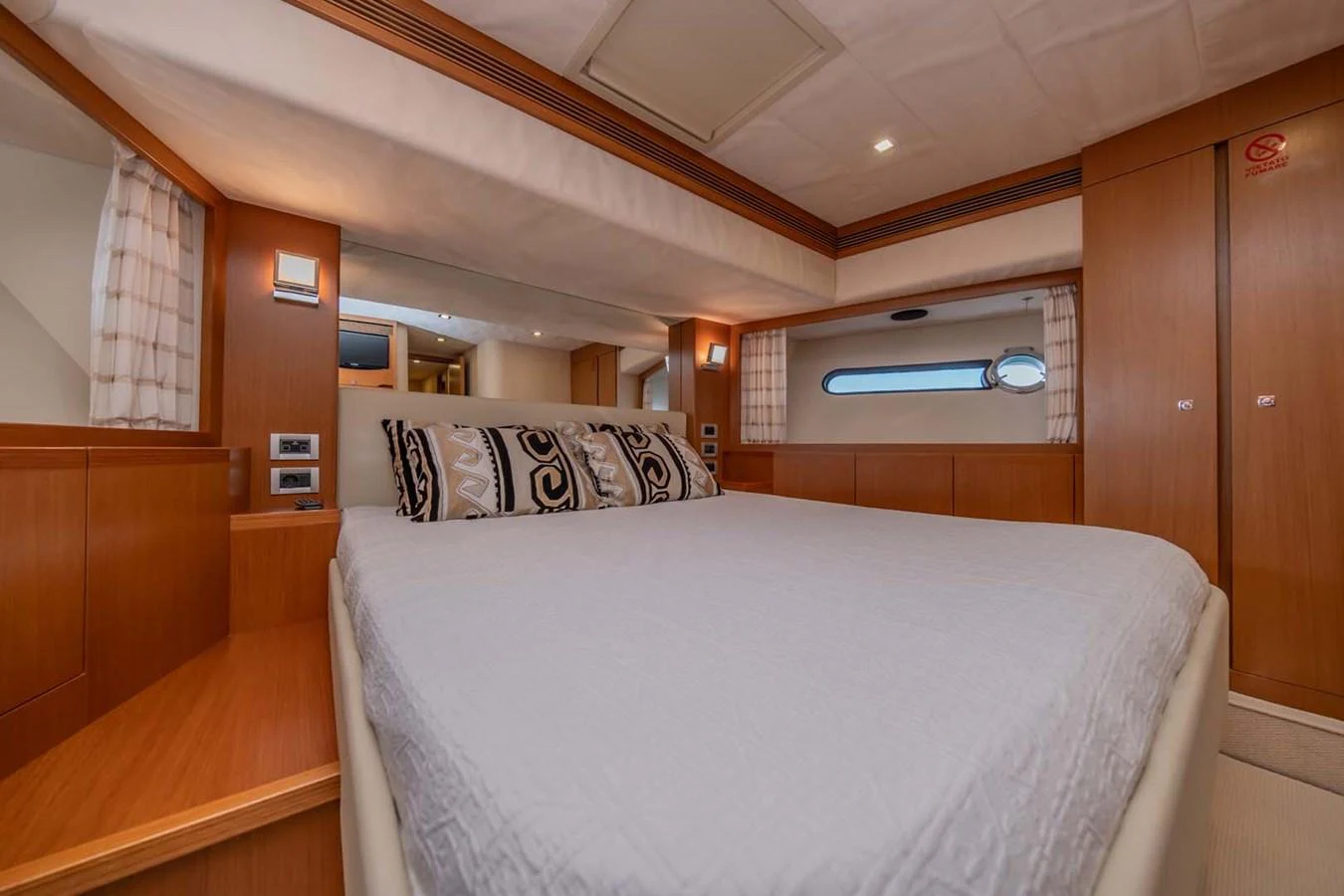 a room with a bed and a window aboard STELLINA Yacht for Sale