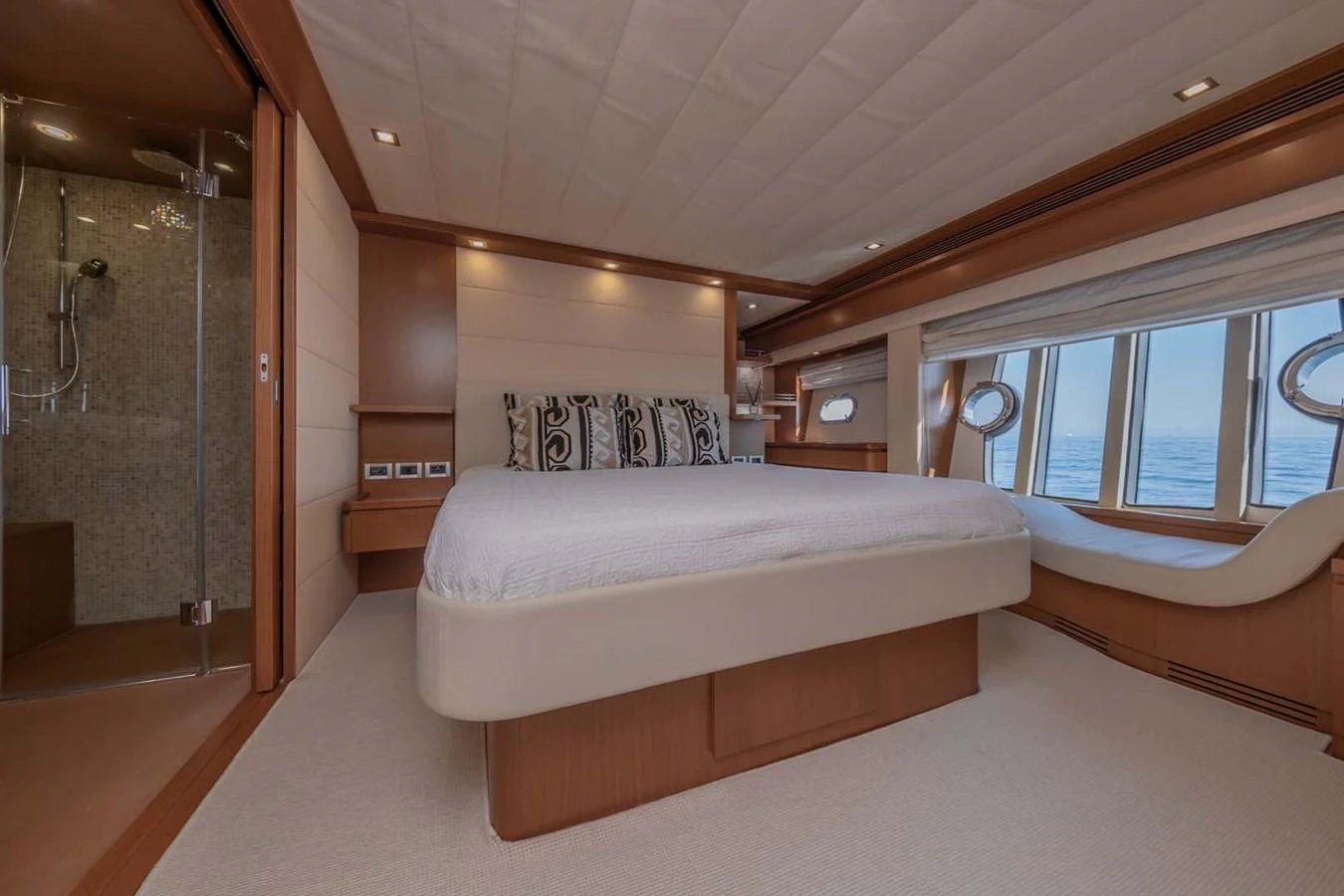 a room with a bed and a window aboard STELLINA Yacht for Sale