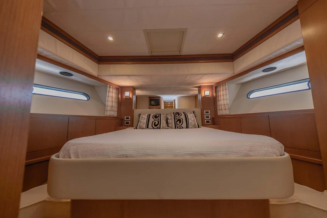 a room with a bed and a window aboard STELLINA Yacht for Sale