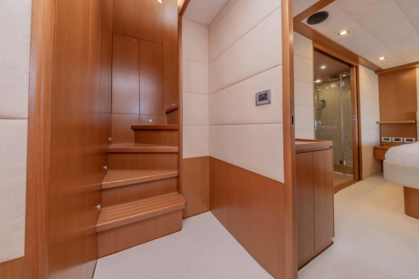 a bathroom with a wood door aboard STELLINA Yacht for Sale