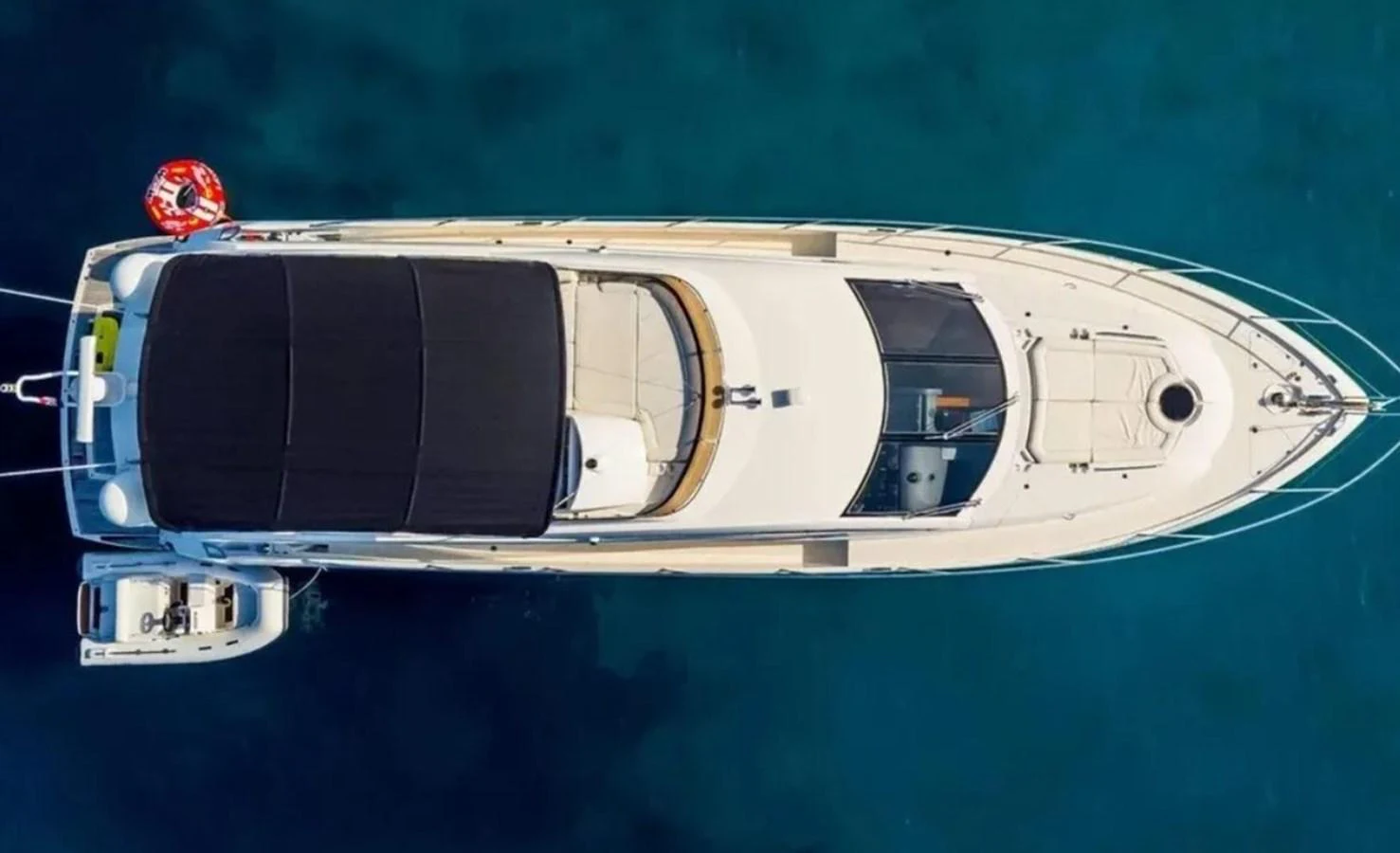 a boat with a blue background aboard 2 DRUNK Yacht for Sale
