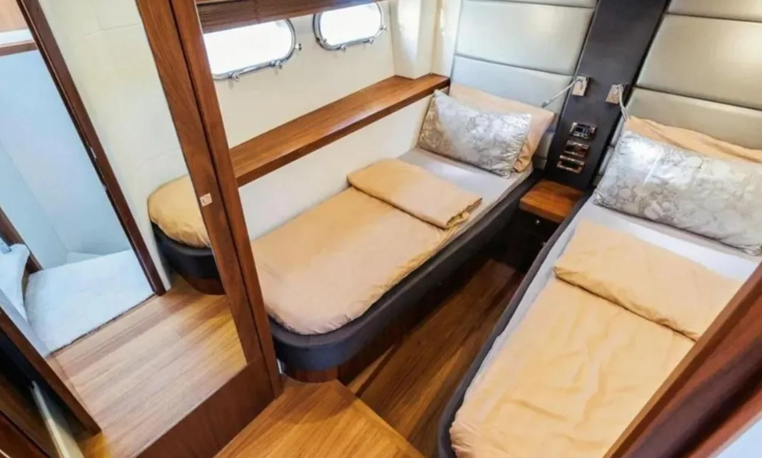 a room with two beds aboard 2 DRUNK Yacht for Sale