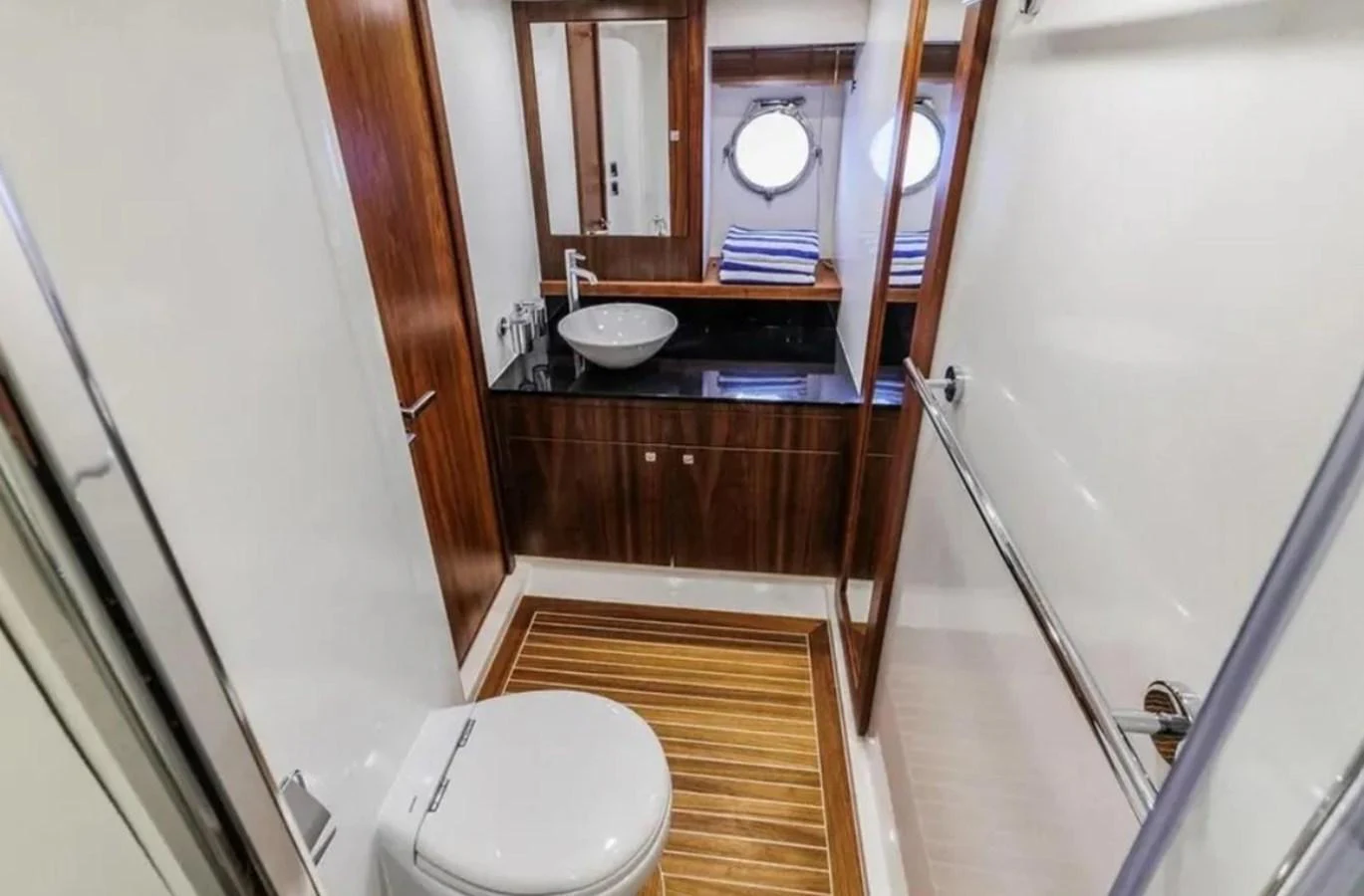 a bathroom with a sink and a toilet aboard 2 DRUNK Yacht for Sale