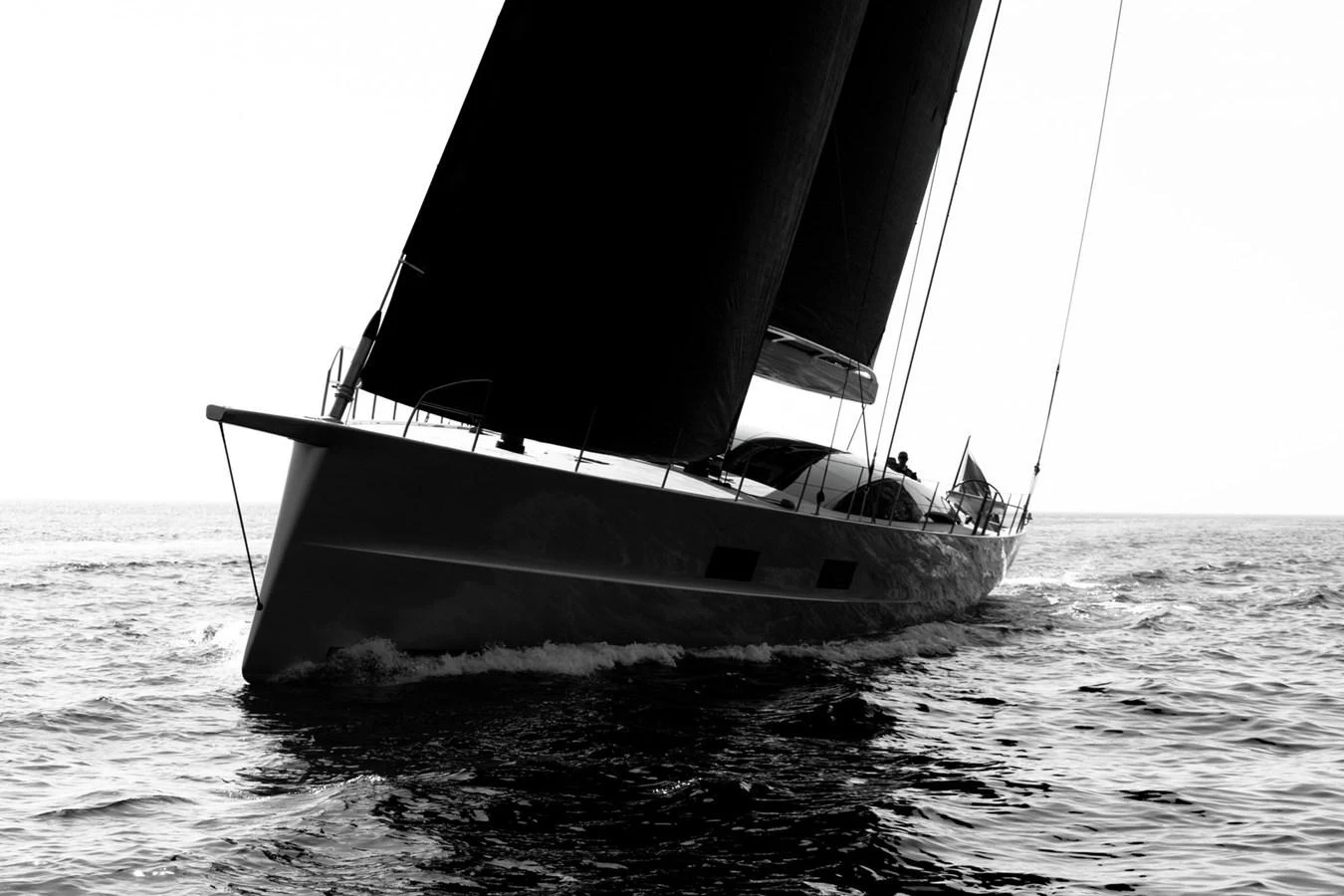 A sleek sailing yacht glides gracefully on the open sea, showcasing its elegant design and powerful sails. aboard ANOMALY Yacht for Sale