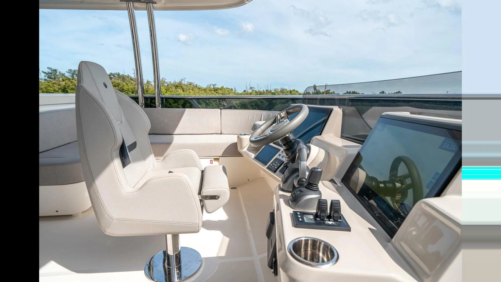 a white boat with a large mirror aboard OUR TRADE Yacht for Sale