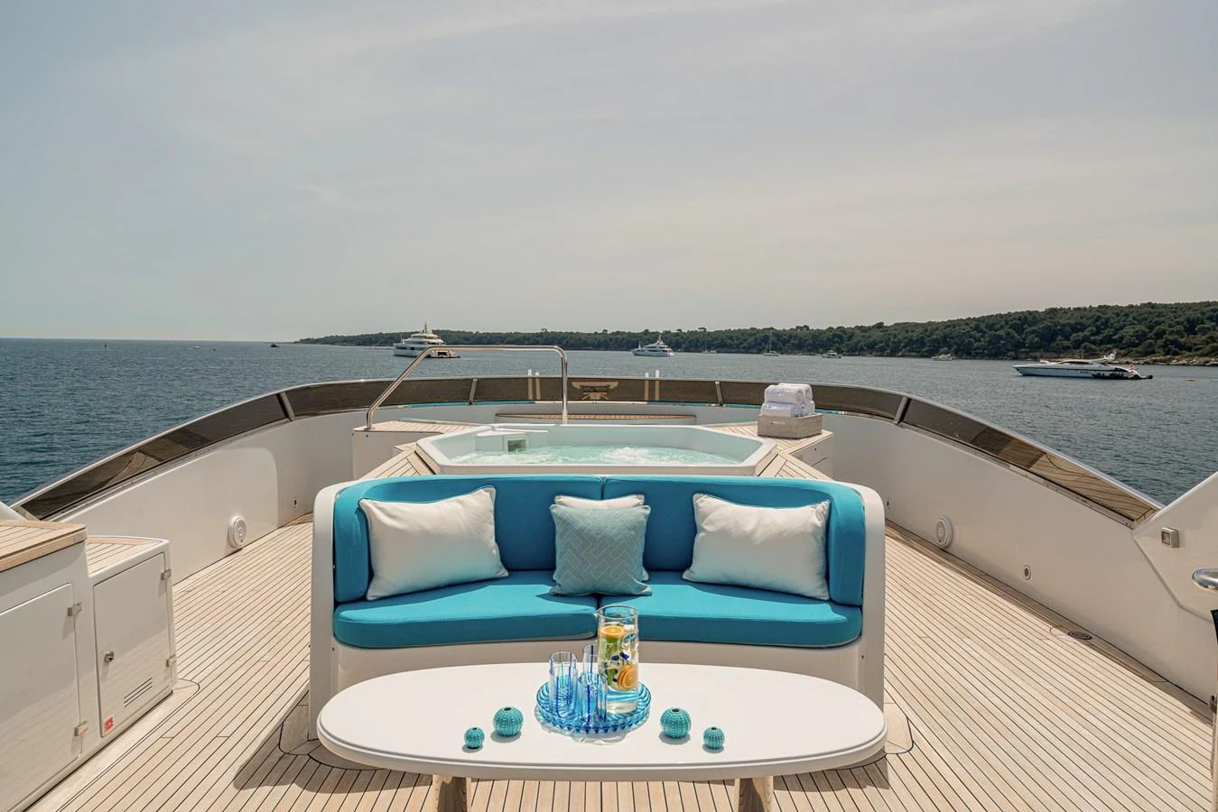 The sundeck features a luxurious seating area with a jacuzzi, offering stunning views of the sea. aboard BANG! Yacht for Sale