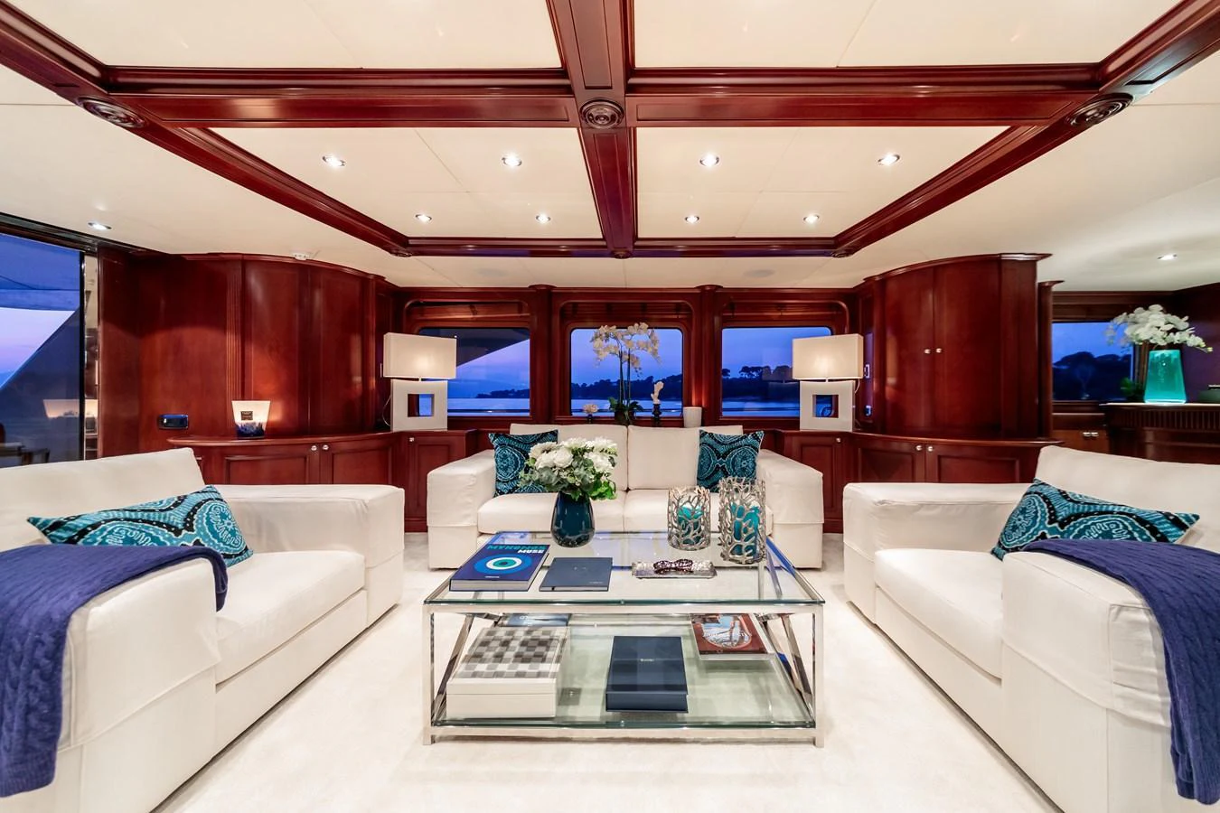 The yacht's salon features luxurious seating with elegant decor and ample natural light. aboard BANG! Yacht for Sale