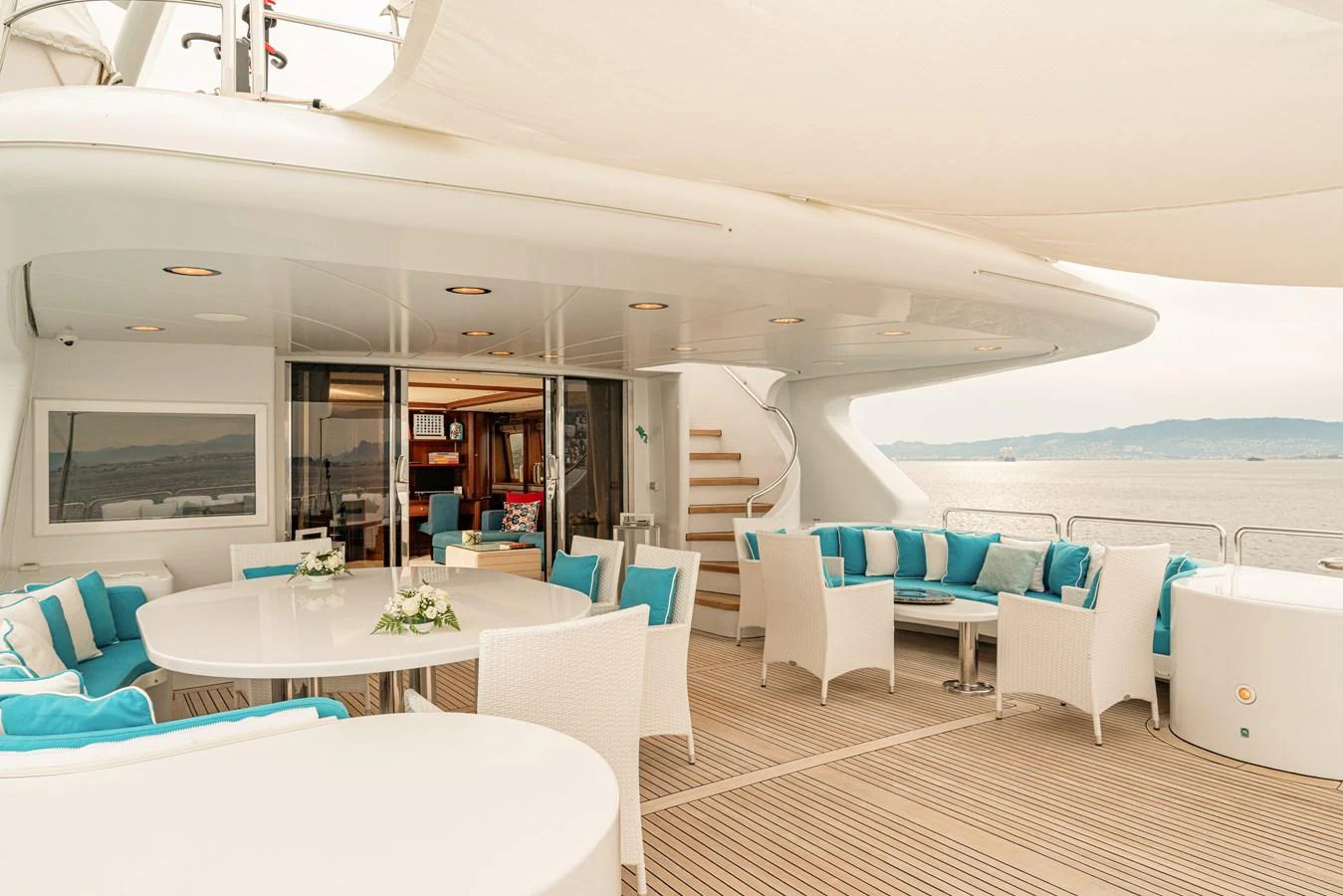The aft deck offers a spacious and elegant outdoor seating area with stunning sea views. aboard BANG! Yacht for Sale