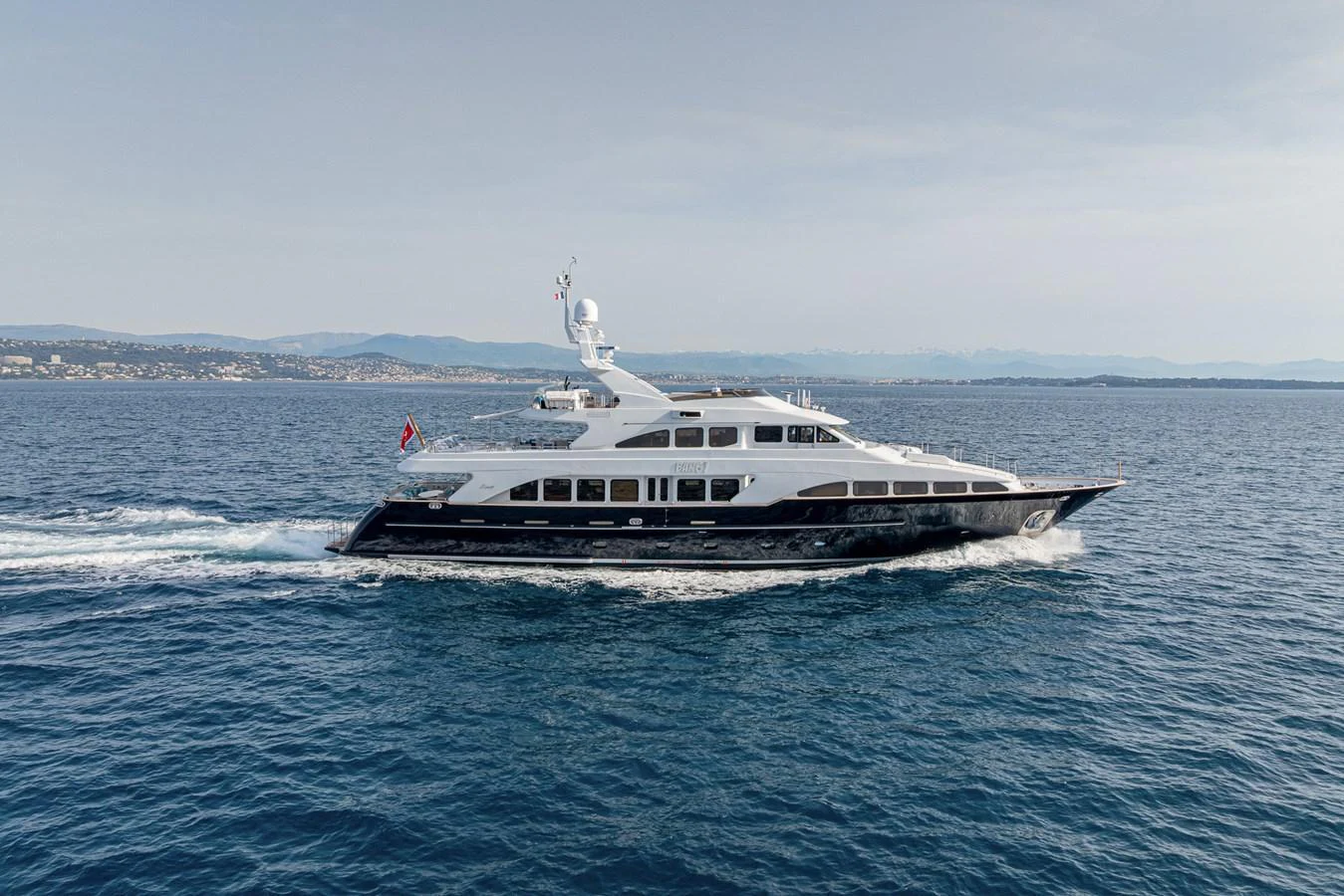 A sleek and elegant yacht cruises smoothly on the open water, showcasing its luxurious design and spacious decks. aboard BANG! Yacht for Sale