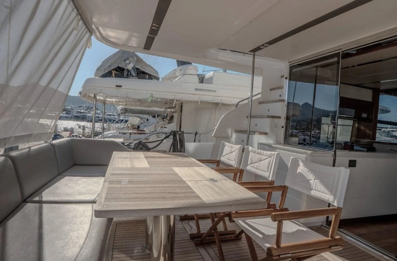 a room with a table and chairs aboard DANI Yacht for Sale