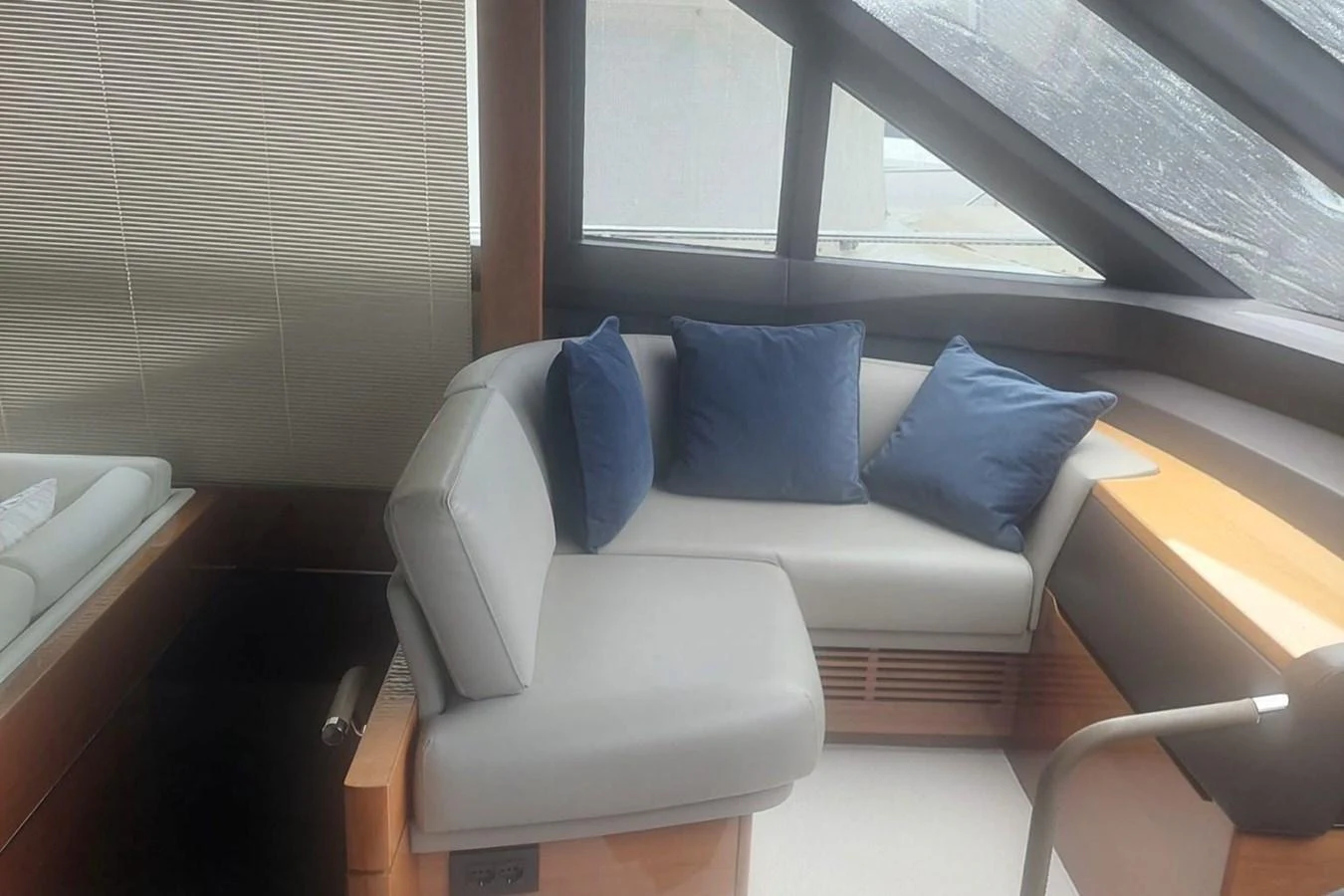 a white couch in a room aboard DANI Yacht for Sale