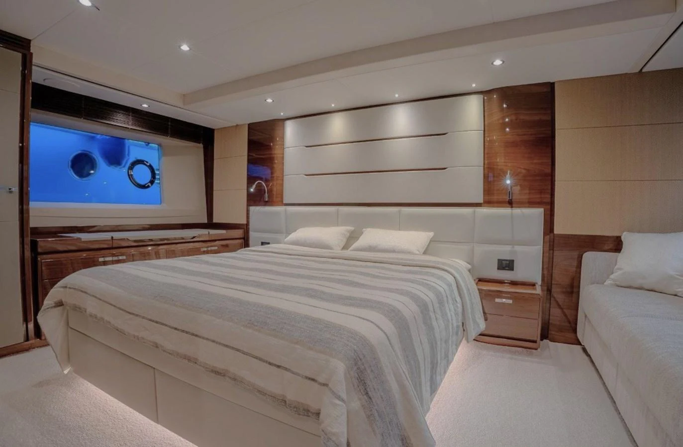 a room with a bed and a television on the wall aboard DANI Yacht for Sale