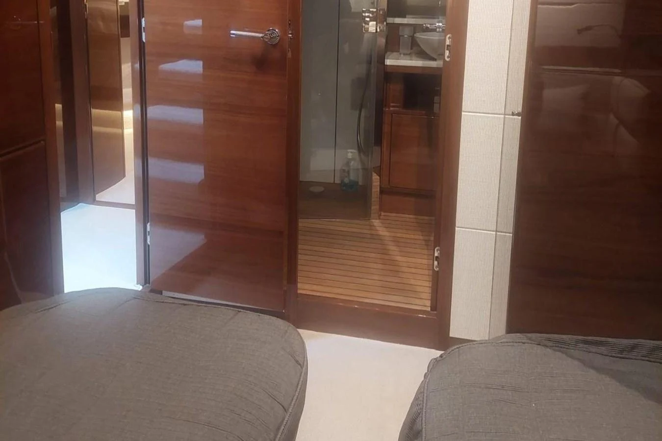 a room with a bed and a closet aboard DANI Yacht for Sale